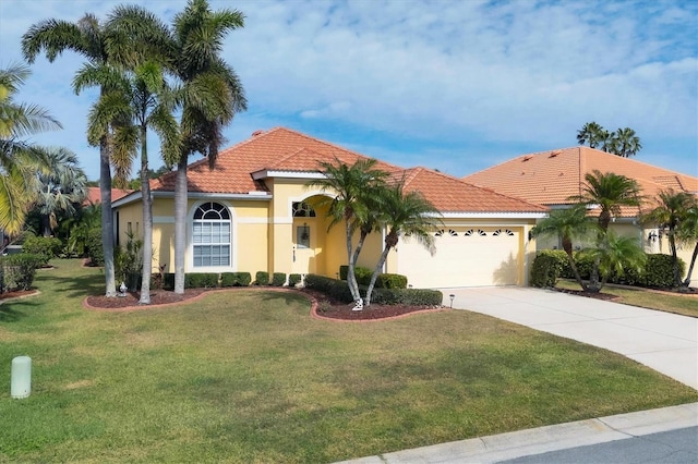 mediterranean / spanish house featuring a garage and a front yard