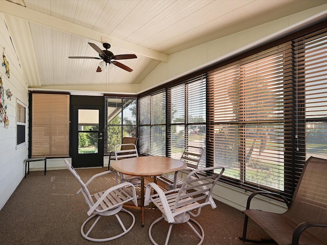 sunroom with vaulted ceiling with beams and ceiling fan