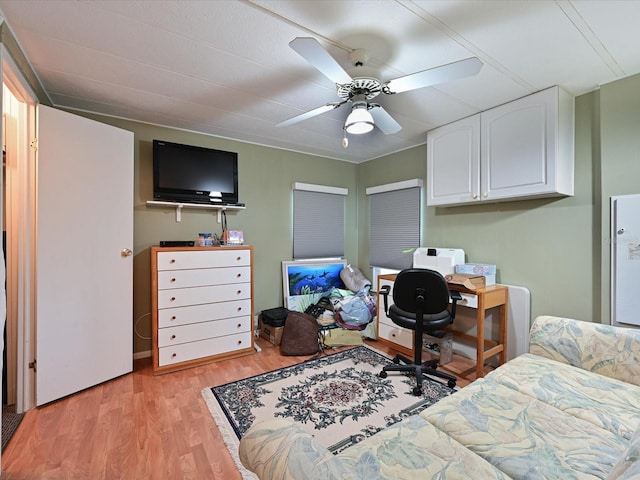 bedroom featuring light wood-type flooring and ceiling fan