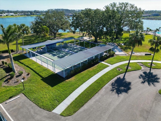 birds eye view of property with a water view