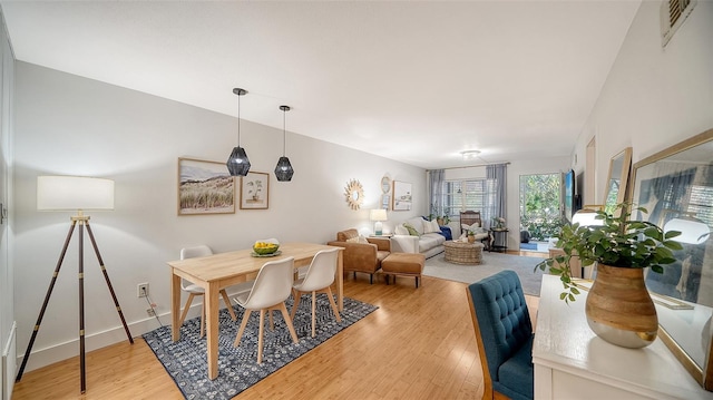 dining room with light hardwood / wood-style flooring