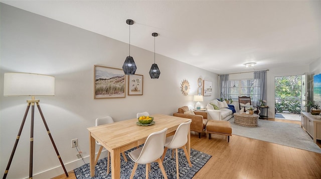 dining area with light hardwood / wood-style flooring