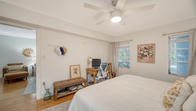 bedroom featuring wood-type flooring and ceiling fan