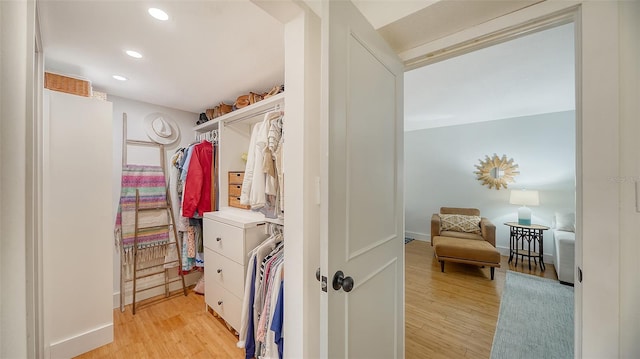 spacious closet featuring light wood-type flooring