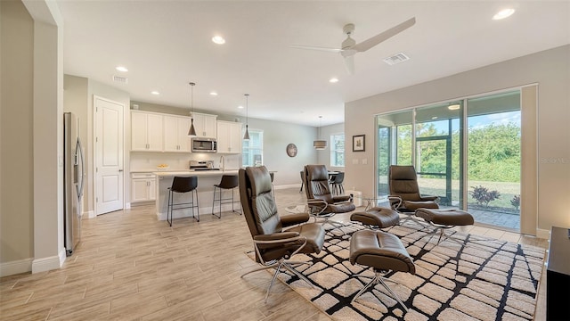 living room featuring ceiling fan