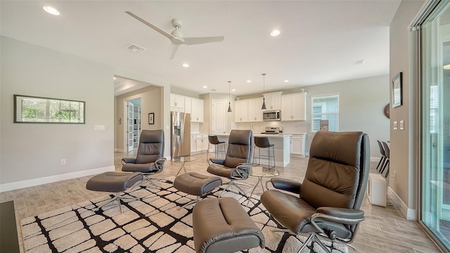 living room featuring ceiling fan