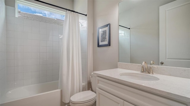 full bathroom featuring vanity, shower / bath combination with curtain, and toilet