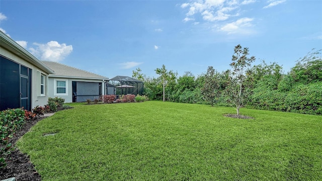 view of yard featuring a lanai