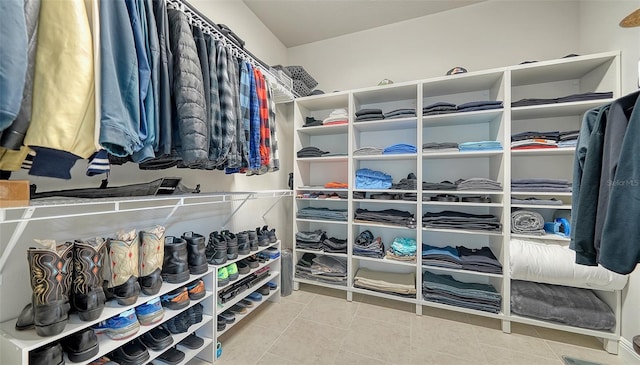 spacious closet featuring light tile patterned flooring