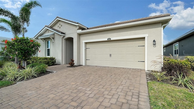 ranch-style home featuring a garage