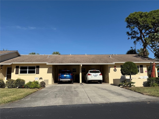 ranch-style house featuring a carport