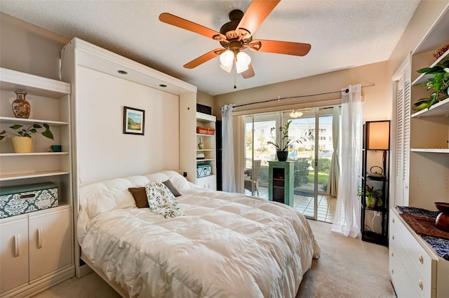 bedroom with light carpet, a textured ceiling, access to outside, and ceiling fan