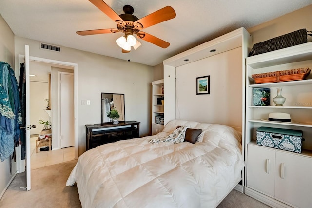 bedroom with light colored carpet and ceiling fan