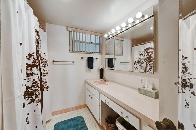 bathroom featuring tile patterned flooring and vanity