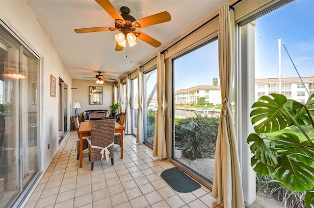 sunroom with ceiling fan and a wealth of natural light