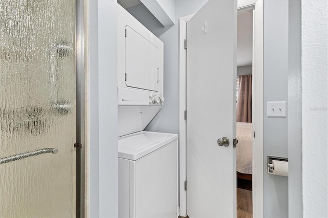 washroom with stacked washer and clothes dryer