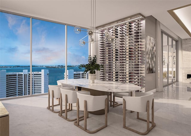 dining room featuring expansive windows and a water view