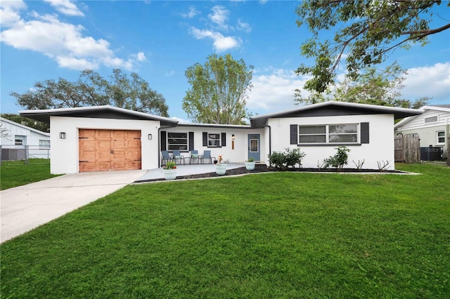 ranch-style home with a front yard and a garage