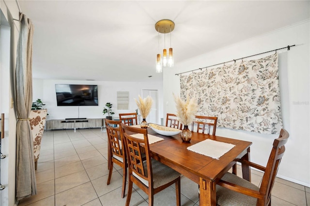 dining room featuring a notable chandelier and light tile patterned floors