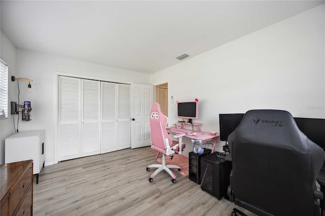 office with light hardwood / wood-style floors