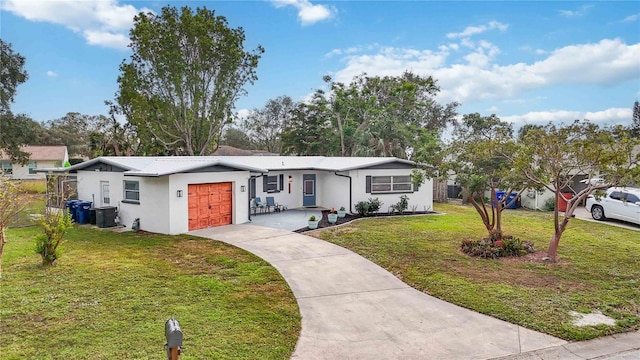 ranch-style house with central AC, a front lawn, and a garage