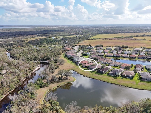 bird's eye view featuring a water view and a residential view