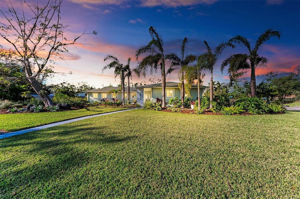 ranch-style house with a lawn