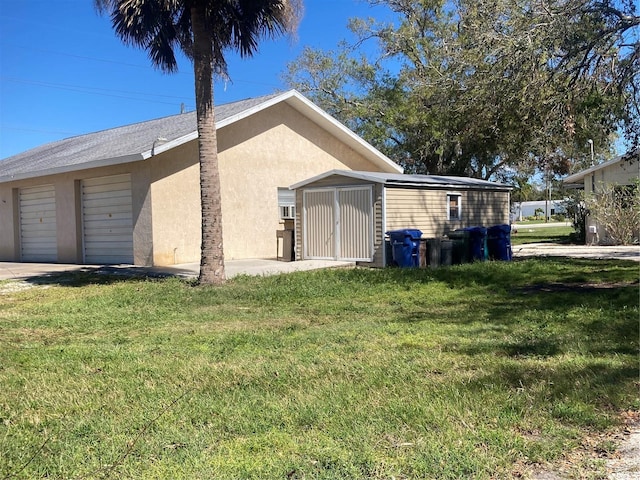 exterior space featuring a yard and a garage