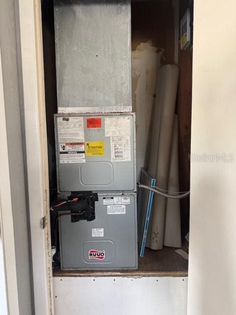 utility room featuring heating unit