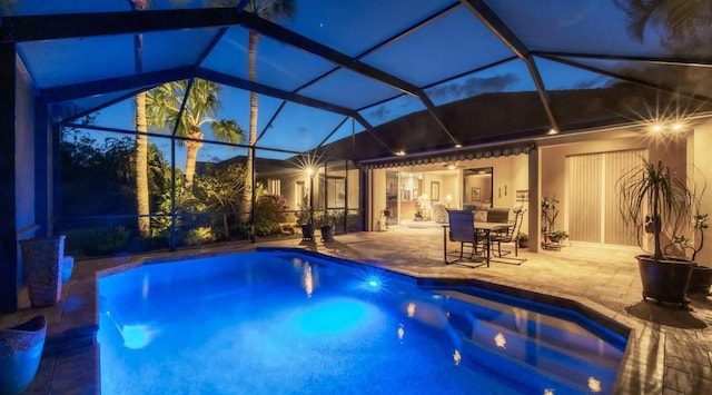 view of swimming pool with a lanai, a patio area, and ceiling fan