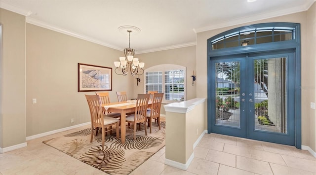 dining area with french doors, an inviting chandelier, light tile patterned floors, and crown molding