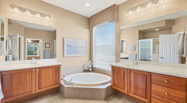 bathroom featuring tile patterned floors, vanity, and separate shower and tub