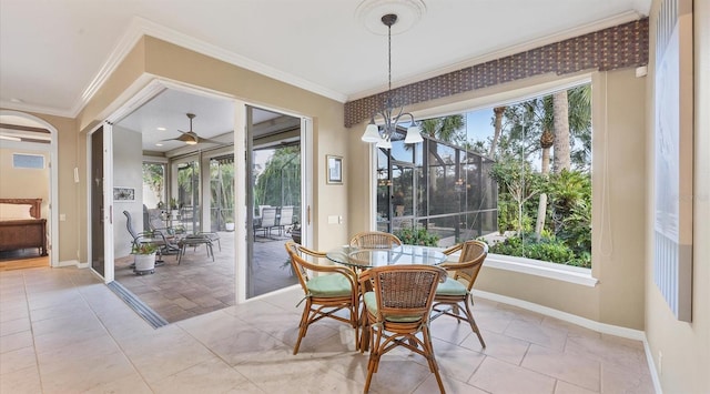 dining area with ceiling fan with notable chandelier and ornamental molding