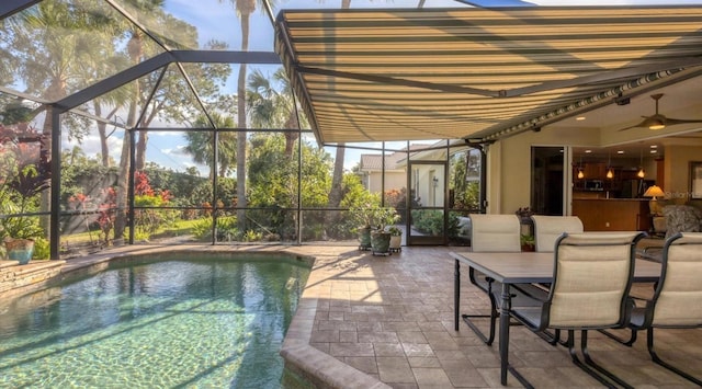 view of pool featuring ceiling fan and a patio