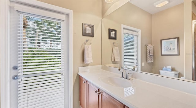 bathroom featuring vanity and toilet