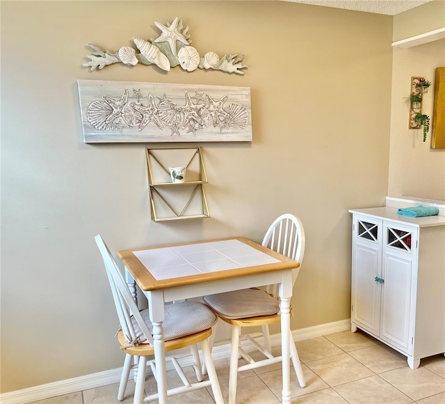 dining space with light tile patterned floors