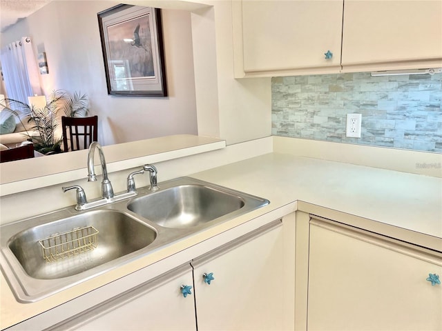 kitchen with backsplash and sink