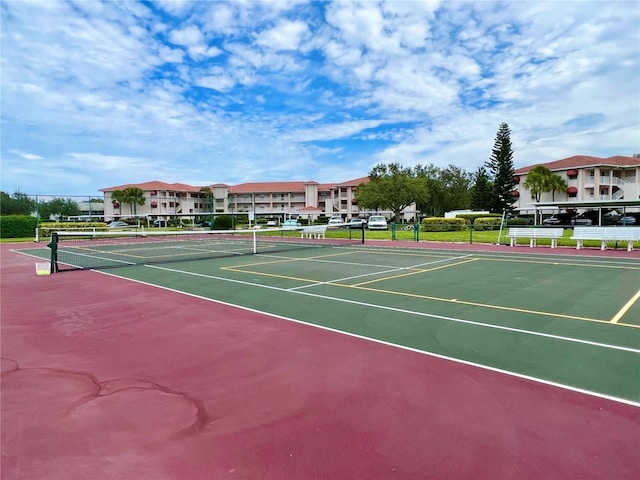 view of tennis court featuring basketball court