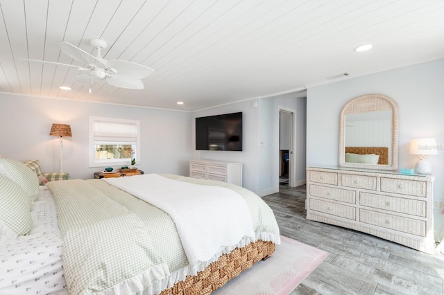 bedroom featuring ceiling fan, wood ceiling, and light hardwood / wood-style flooring