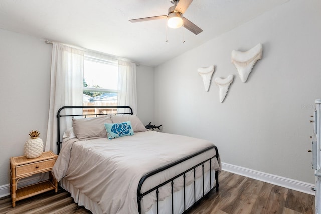 bedroom featuring ceiling fan and dark wood-type flooring