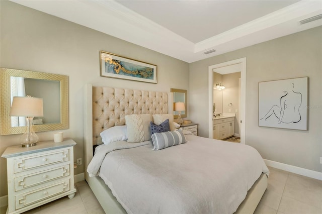 tiled bedroom with a raised ceiling and ensuite bathroom