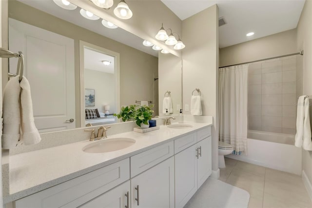 full bathroom featuring toilet, shower / bath combo, vanity, and tile patterned floors