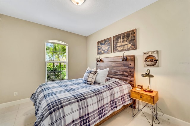 bedroom featuring light tile patterned flooring