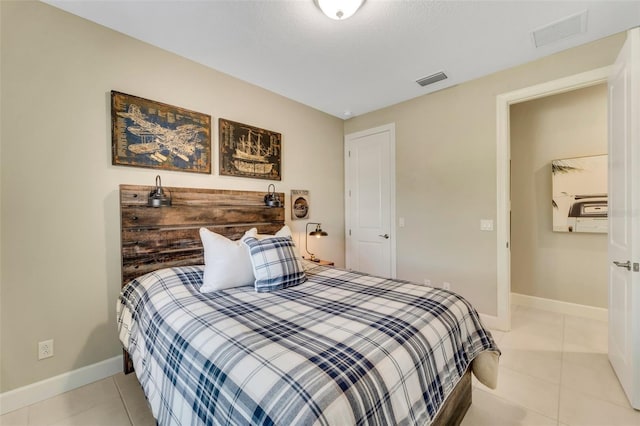 bedroom with light tile patterned flooring