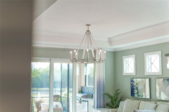 interior space featuring a textured ceiling, a notable chandelier, and crown molding