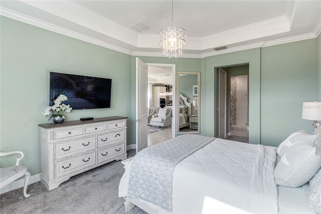 bedroom featuring an inviting chandelier, ornamental molding, light carpet, and a tray ceiling