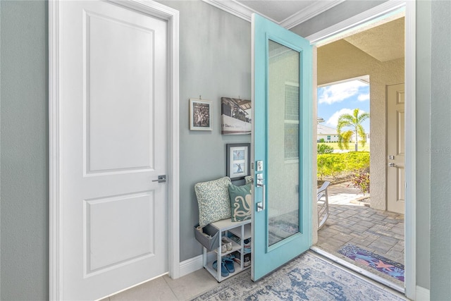 doorway featuring ornamental molding and french doors