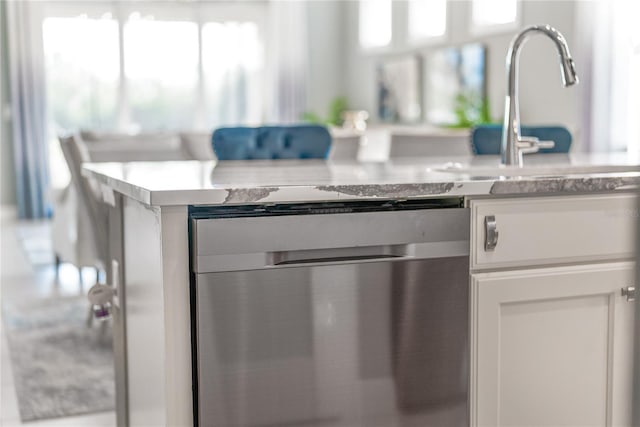 interior details with white cabinets and dishwasher