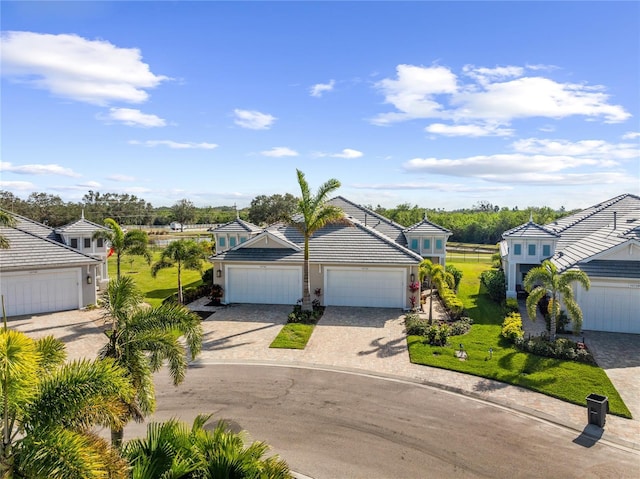 view of front of property featuring a garage and a front yard