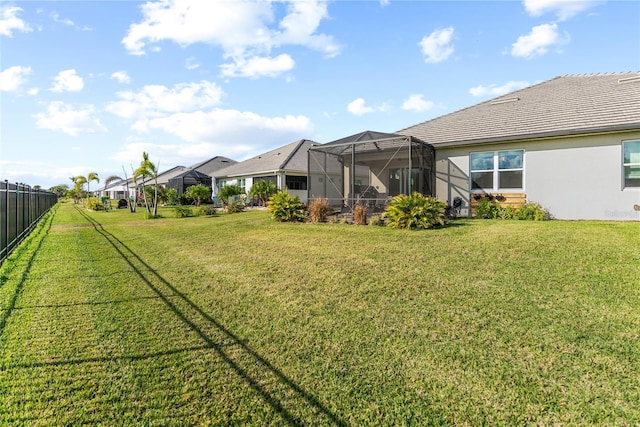 view of yard featuring a lanai